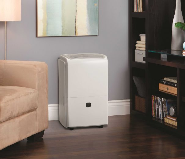 Commercial dehumidifier drying a finished basement